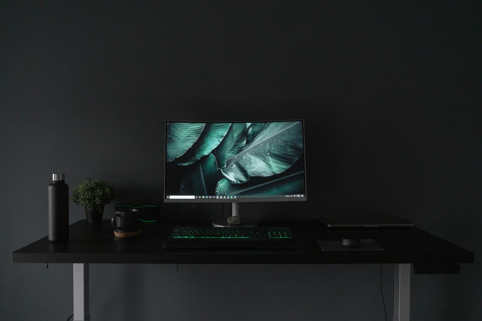 Monitor on a dark desk setup